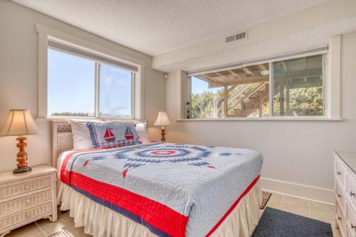 a bedroom with a bed and a large window at Sea-Esta in Tierra Del Mar - Meredith Lodging in Tierra Del Mar