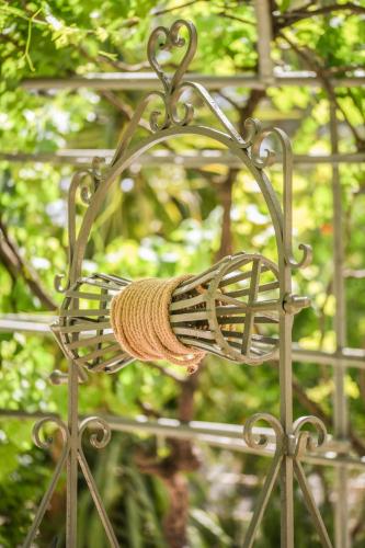 a bird feeder with a rope hanging from it at Therianos Traditional Villas in Kallithea