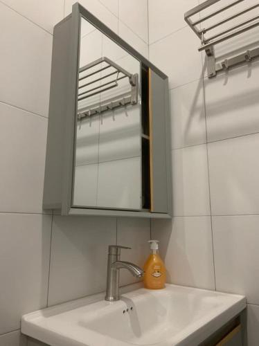a bathroom with a sink and a mirror at Kota Permai Free n Easy Interior Bukit Mertajam in Bukit Mertajam