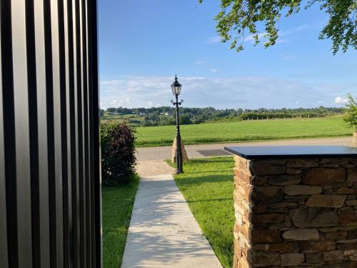 a street light on the side of a sidewalk at Tiny House - Luxury Cottage in Bullange