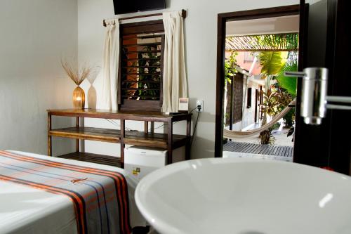 Cama ou camas em um quarto em Pousada Por do Sol