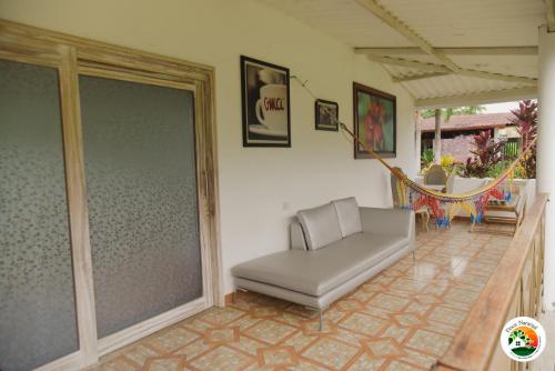 Uma área de estar em Hotel Finca Naranjal