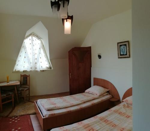 Cama ou camas em um quarto em Fodor Vendégház