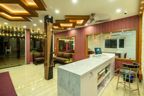 a lobby with a bar and a living room at Daan Regency in Trichūr