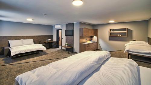 Ένα ή περισσότερα κρεβάτια σε δωμάτιο στο ABA Apartments