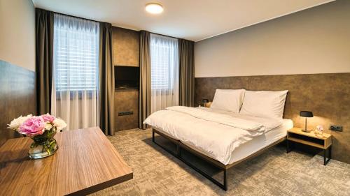 Ένα ή περισσότερα κρεβάτια σε δωμάτιο στο ABA Apartments