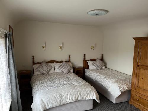 Cama o camas de una habitación en Ros Villa Guesthouse
