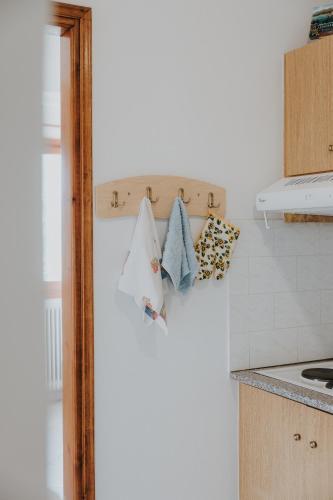 a kitchen with a shelf with pillows on it at House of Gardenia in Makrirrákhi