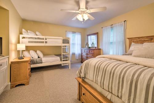 a bedroom with two bunk beds and a ceiling fan at Large Yard and Games Edgewater Escape in Paupack! in Paupack