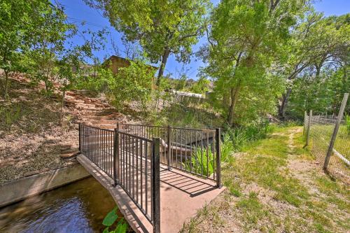 a gate leading down to a river with a bridge at Guest Suite with Patio in Arizona Wine Country in Cornville
