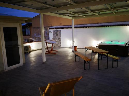 a room with ping pong tables and a pool table at B&B Tonnarella Beach in Torre Forte