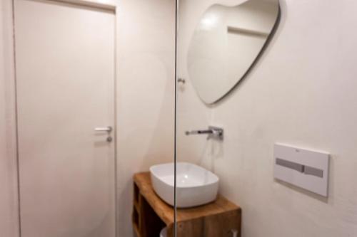 a bathroom with a sink and a mirror at Alex & Sofi Hotel in Himare
