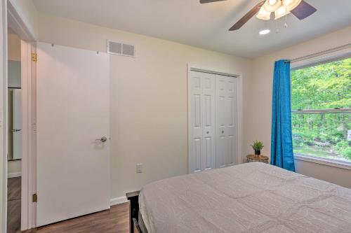a bedroom with a bed and a window at Hot Tub and 2 Game Rooms Family Poconos Getaway! in Pocono Summit