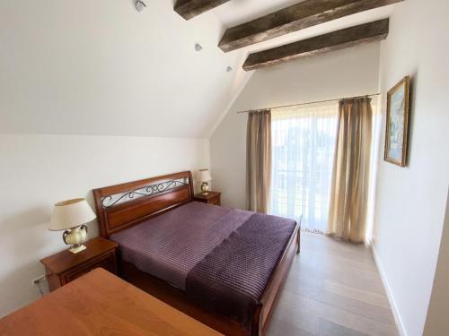 Кровать или кровати в номере Janus Vila Karkleje
