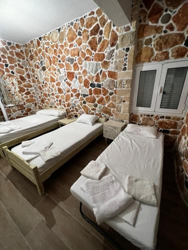 Ένα ή περισσότερα κρεβάτια σε δωμάτιο στο Malvina Rooms
