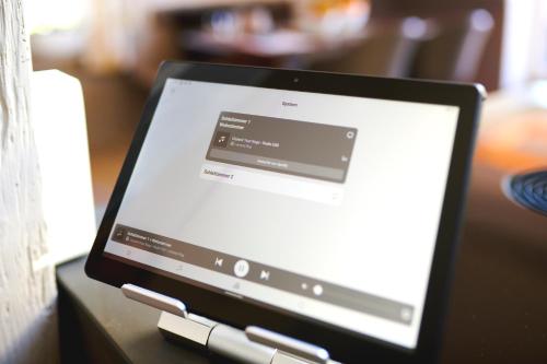 a tablet computer sitting on top of a table at Goldmädchen 93 - Honeymoon Suite in Timmendorfer Strand