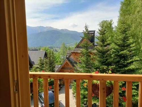 a view from the balcony of a log cabin at Bajkowy domek in Kościelisko