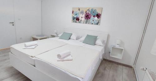 Postel nebo postele na pokoji v ubytování Apartman Bloom