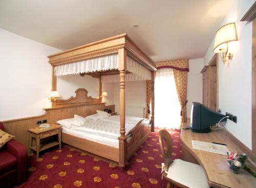 Postel nebo postele na pokoji v ubytování Hotel Flora