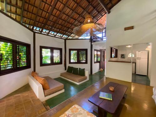 a living room with a couch and a table at Pousada Big Bambu in Trancoso