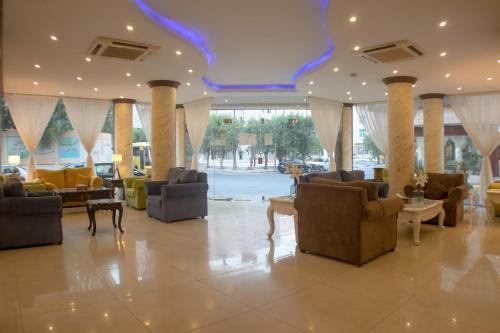 a lobby with couches and chairs in a building at شقق أمواج للشقق المخدومة in Al Khobar