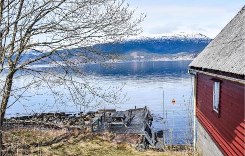 a view of a body of water with a red house at 3 Bedroom Lovely Home In Kysnesstrand in Gausvik