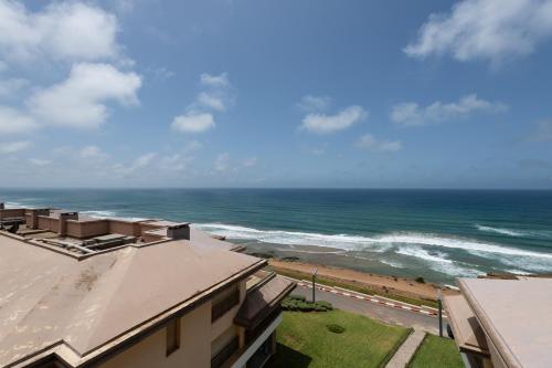 a view of the ocean from a building at Appartement 300m2 vue sur océan Prestigia - Plage des nations in Sale