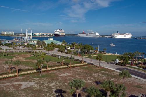 a view of a harbor with cruise ships in the water at Motel 6-Cocoa Beach, FL in Cocoa Beach