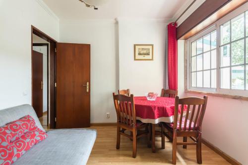 a dining room with a table and chairs and a window at Isabel Dream I, 400m from the train in Rinchoa
