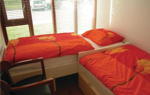 Katil atau katil-katil dalam bilik di Bungalowpark Wijdland-aak