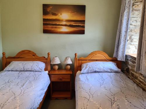 Postel nebo postele na pokoji v ubytování Puffin Cottage
