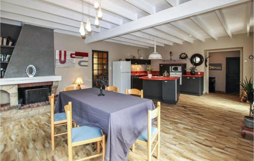 a kitchen and dining room with a table and chairs at Cozy Home In Montoison in Montoison