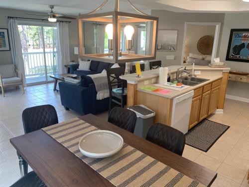 a kitchen and living room with a table and a dining room at 2504 Commons II in Calabash