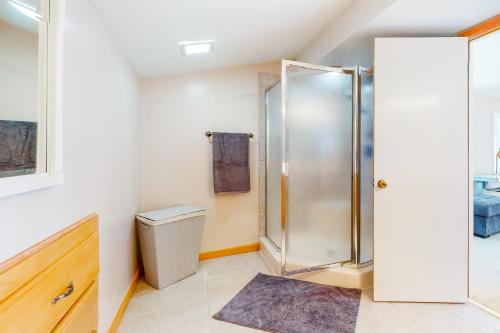 a bathroom with a shower and a toilet at Fenwick Island - 38829 Bunting Avenue #1 in Fenwick Island