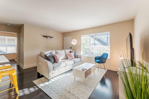 a living room with a couch and a table at Extended Stay Apartments Next to Downtown in Austin