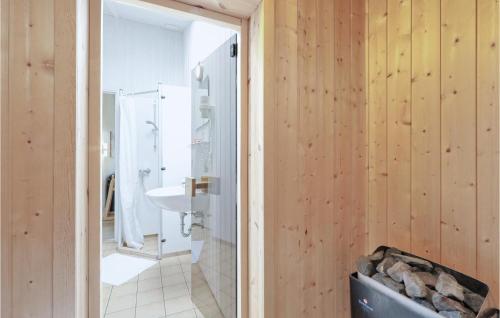 a bathroom with a shower and a sink at Frische Brise 4 - Dorf 3 in Priwall
