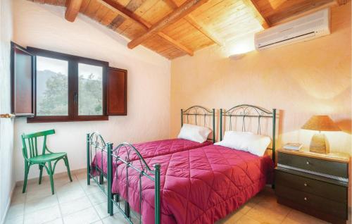 a bedroom with a bed and a desk and a chair at Rustico Gli Oleandri in Orgosolo