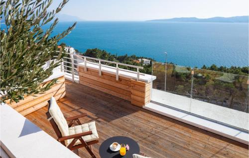 a balcony with a view of the ocean at Stunning Home In Omis With Kitchen in Omiš