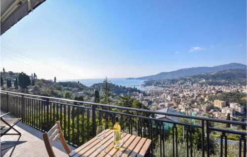 a balcony with a table and a view of a city at Nice Home In Rapallo With Kitchen in Rapallo