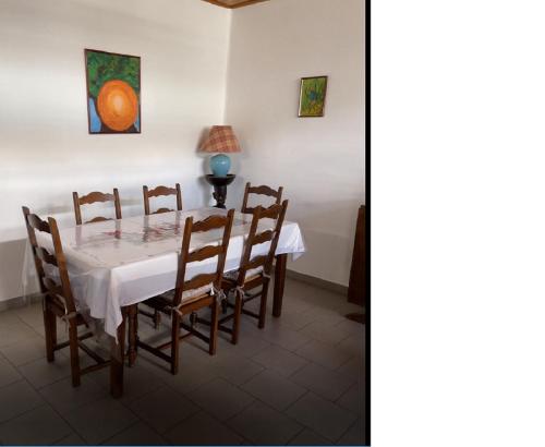 a dining room with a table and chairs at CD House in Fort-de-France