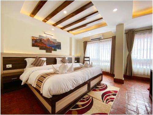 a bedroom with a large bed in a room at Satkar Boutique Home in Kathmandu