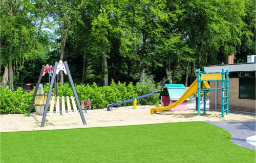 a playground with a slide and a swing set at 2 Bedroom Lovely Home In Overberg in Overberg