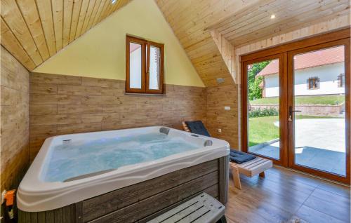 a large jacuzzi tub in a room at Lovely Home In Rivalno With Sauna in Slanje