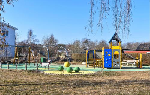 a park with a playground with a slide at Lovely Home In Hasslö With Kitchen in Hasslö