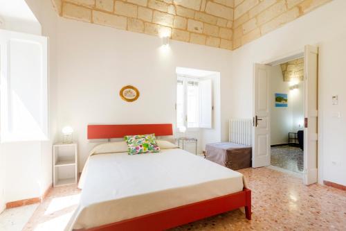 a bedroom with a large bed in a room at Civico 22 B&B in Cannole