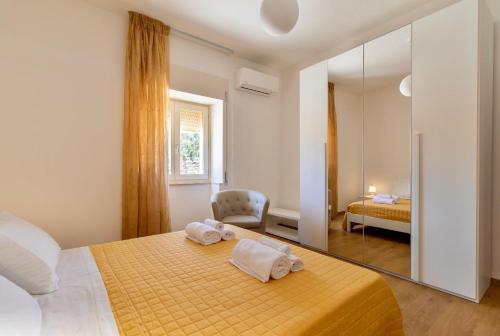 A bed or beds in a room at Casa vacanza i due ulivi