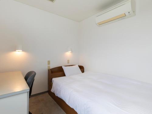 Postel nebo postele na pokoji v ubytování Tabist Hotel Yuan Akashi