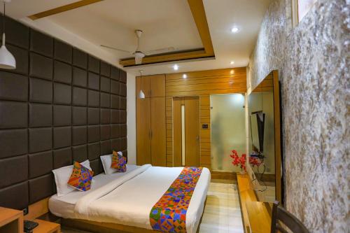 a bedroom with a bed in a room at FabHotel Sun Park in Bhopal