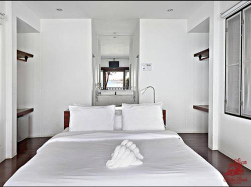 Un pat sau paturi într-o cameră la Tubtim Resort