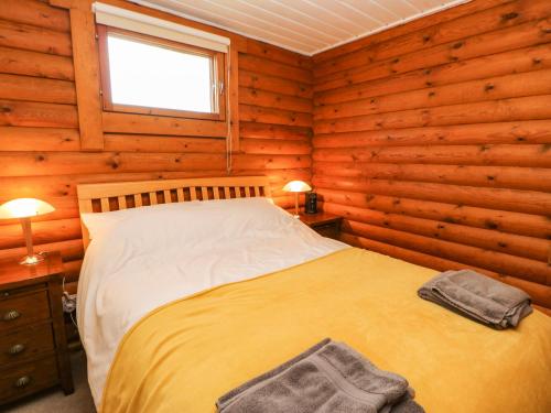 Postel nebo postele na pokoji v ubytování Alwinton Lodge